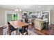Well-lit kitchen with stainless steel appliances, granite counters and direct access to the backyard at 755 Waterbrook Ter, Roswell, GA 30076