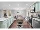 Modern kitchen featuring an island, stainless steel appliances, and hardwood floors at 755 Waterbrook Ter, Roswell, GA 30076