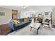 Spacious living room with hardwood floors, and direct access to the kitchen and dining at 755 Waterbrook Ter, Roswell, GA 30076