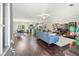 Open concept living space with hardwood floors, and combined kitchen and dining area at 755 Waterbrook Ter, Roswell, GA 30076