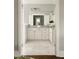 Stylish bathroom featuring marble floors, white cabinetry, and ample counter space at 775 A Harrison Se Pl, Atlanta, GA 30315