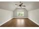 Large bedroom with a ceiling fan and window providing outdoor views and natural light at 775 A Harrison Se Pl, Atlanta, GA 30315