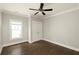 Bedroom featuring hardwood floors, white trim, and a double door closet at 775 A Harrison Se Pl, Atlanta, GA 30315