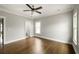 Spacious bedroom with hardwood floors, natural light, and modern ceiling fan at 775 A Harrison Se Pl, Atlanta, GA 30315