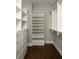 Well-organized walk-in closet with built-in shelving and ample storage space at 775 A Harrison Se Pl, Atlanta, GA 30315