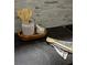 Kitchen detail with decorative containers on a dark stone countertop and stone backsplash at 775 A Harrison Se Pl, Atlanta, GA 30315