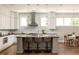 Modern kitchen with stainless steel appliances, a large island, pendant lighting and breakfast bar seating at 775 A Harrison Se Pl, Atlanta, GA 30315