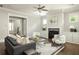 Bright living room featuring a cozy fireplace, hardwood floors, and lots of natural light at 775 A Harrison Se Pl, Atlanta, GA 30315
