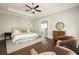 Bright main bedroom with tray ceiling, sitting area, and en-suite bathroom at 775 A Harrison Se Pl, Atlanta, GA 30315