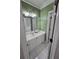 Bathroom featuring a single sink vanity and a mirror with overhead lighting at 1042 Emory Parc Pl, Decatur, GA 30033