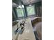 Bathroom with blue walls, decorative window, soaking tub, shower, and and vanities at 1042 Emory Parc Pl, Decatur, GA 30033