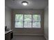 This is a cozy bedroom space with a large window offering plenty of natural light at 1042 Emory Parc Pl, Decatur, GA 30033