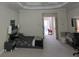 Bedroom with tray ceiling, ceiling fan, carpet, and a bed with decorative pillows at 1042 Emory Parc Pl, Decatur, GA 30033