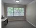 Bedroom with large windows providing natural light and neutral carpet at 1042 Emory Parc Pl, Decatur, GA 30033