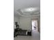 Bedroom featuring tray ceiling, ceiling fan, and neutral colored carpet at 1042 Emory Parc Pl, Decatur, GA 30033