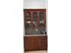 Traditional wood cabinet with glass doors and granite countertops offers practical storage at 1042 Emory Parc Pl, Decatur, GA 30033