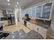 Modern kitchen with granite countertops, stainless steel appliances, and ample cabinet space, designed for convenience and style at 1042 Emory Parc Pl, Decatur, GA 30033