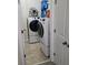 Modern white washer and dryer appliances with an overhead fan in the laundry room at 1042 Emory Parc Pl, Decatur, GA 30033
