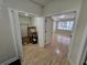 Living room with hardwood floors, and natural light, adjacent to a closet with open doors at 1042 Emory Parc Pl, Decatur, GA 30033