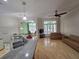Bright, open concept living room with granite counters, hardwood floors, and multiple seating areas at 1042 Emory Parc Pl, Decatur, GA 30033