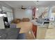 Open living space with hardwood floors, a fireplace, and a kitchen island with granite countertops, ideal for modern living at 1042 Emory Parc Pl, Decatur, GA 30033