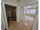 Living room with hardwood floors, and natural light, adjacent to a closet with open doors at 1042 Emory Parc Pl, Decatur, GA 30033
