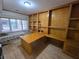 Bright home office with built-in wooden desk, shelving, and a comfortable daybed near a window at 1042 Emory Parc Pl, Decatur, GA 30033