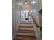 Elegant staircase featuring decorative wall panels with a wooden railing, perfect for a grand entrance at 1042 Emory Parc Pl, Decatur, GA 30033