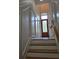 Elegant staircase featuring decorative wall panels with a wooden railing, perfect for a grand entrance at 1042 Emory Parc Pl, Decatur, GA 30033
