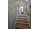 Elegant staircase with decorative wall panels leading to the entryway at 1042 Emory Parc Pl, Decatur, GA 30033