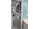 This walk-in closet has custom shelving, drawers, and ample storage space; it is adjacent to the bathroom at 1042 Emory Parc Pl, Decatur, GA 30033