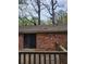 Exterior view showing a brick wall and sliding door to deck at 2137 Plantation Ln, Chamblee, GA 30341