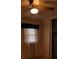This bedroom features a ceiling fan, window with curtains, and closet with sliding doors at 2137 Plantation Ln, Chamblee, GA 30341
