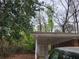 Attached carport providing covered parking and storage space at 2137 Plantation Ln, Chamblee, GA 30341