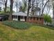 Charming brick home featuring a well-maintained lawn and inviting front porch at 2137 Plantation Ln, Chamblee, GA 30341