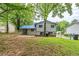 Backyard view of the home showing a patio, yard and the home's siding at 2347 Fairway Sw Cir, Atlanta, GA 30331