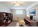 Virtually staged bedroom with carpet, built-in bookshelves and a window at 2347 Fairway Sw Cir, Atlanta, GA 30331