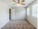 Bedroom with neutral paint, carpeted floor, ceiling fan and natural light at 2347 Fairway Sw Cir, Atlanta, GA 30331