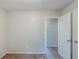 Empty bedroom showcases neutral walls, carpeted floors, and interior door at 2347 Fairway Sw Cir, Atlanta, GA 30331