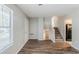 Bright living room featuring wood floors, stairs, and lots of natural light at 2347 Fairway Sw Cir, Atlanta, GA 30331