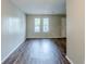Featuring new wood flooring, the living area is bathed in natural light at 2347 Fairway Sw Cir, Atlanta, GA 30331