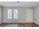 The spacious living room boasts new wood flooring and is bathed in natural light at 2347 Fairway Sw Cir, Atlanta, GA 30331