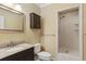 Bathroom featuring a shower, vanity with granite countertop, and neutral color palette at 2840 Peachtree Nw Rd # 307, Atlanta, GA 30305