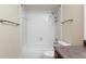 This is a cozy bathroom featuring a shower-tub combo with a white tiled surround at 2840 Peachtree Nw Rd # 307, Atlanta, GA 30305