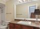 Bathroom featuring a vanity with framed mirror, a full bathtub, and neutral walls at 2840 Peachtree Nw Rd # 307, Atlanta, GA 30305