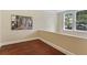 Bright bedroom featuring hardwood floors, natural light, and a decorative New York City print at 2840 Peachtree Nw Rd # 307, Atlanta, GA 30305