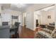 Open-concept dining area with hardwood floors, flowing into a living space with comfortable seating at 2840 Peachtree Nw Rd # 307, Atlanta, GA 30305