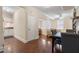 A naturally lit dining area shows hardwood floors and views of the kitchen and living room at 2840 Peachtree Nw Rd # 307, Atlanta, GA 30305