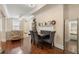 An open-concept dining area with hardwood floors and a view of the kitchen at 2840 Peachtree Nw Rd # 307, Atlanta, GA 30305