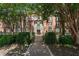 Elegant brick apartment building with well-manicured landscaping and a welcoming walkway leading to the entrance at 2840 Peachtree Nw Rd # 307, Atlanta, GA 30305